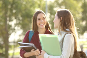 2 women smiling at school