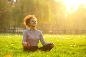 woman sitting in field